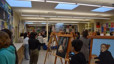 Yale Secondary - Semester 1 Art Show Art displays set up for Art show. Students walking around looking at art pieces