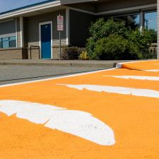 Orange crosswalk with orange feathers