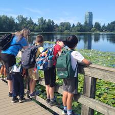 Class look over dock into mill lake for BC painted turtles