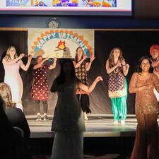ATS Staff on stage performing a Bhangra dance